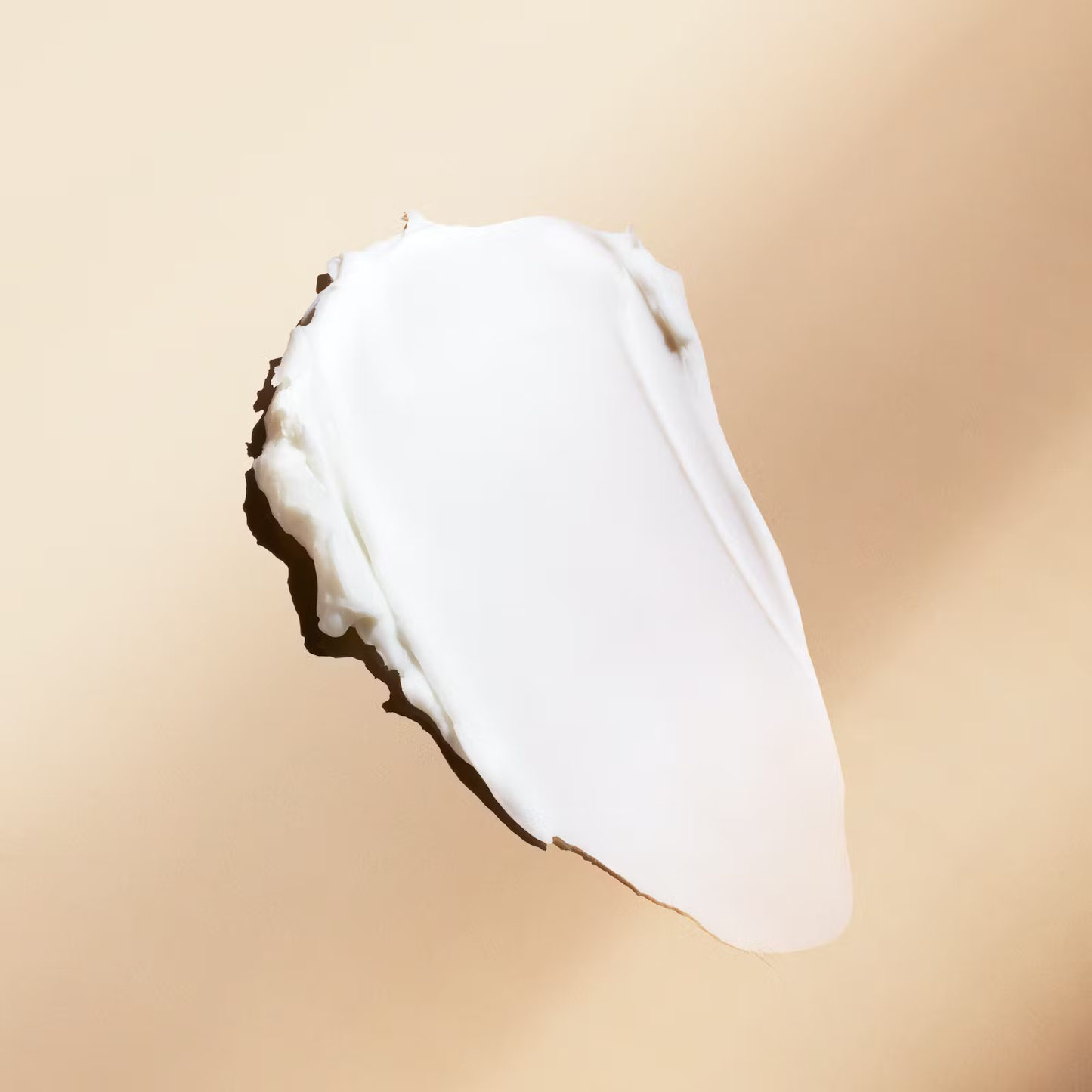 Dollar Shave Club Hair Fiber features white cream with medium consistency.