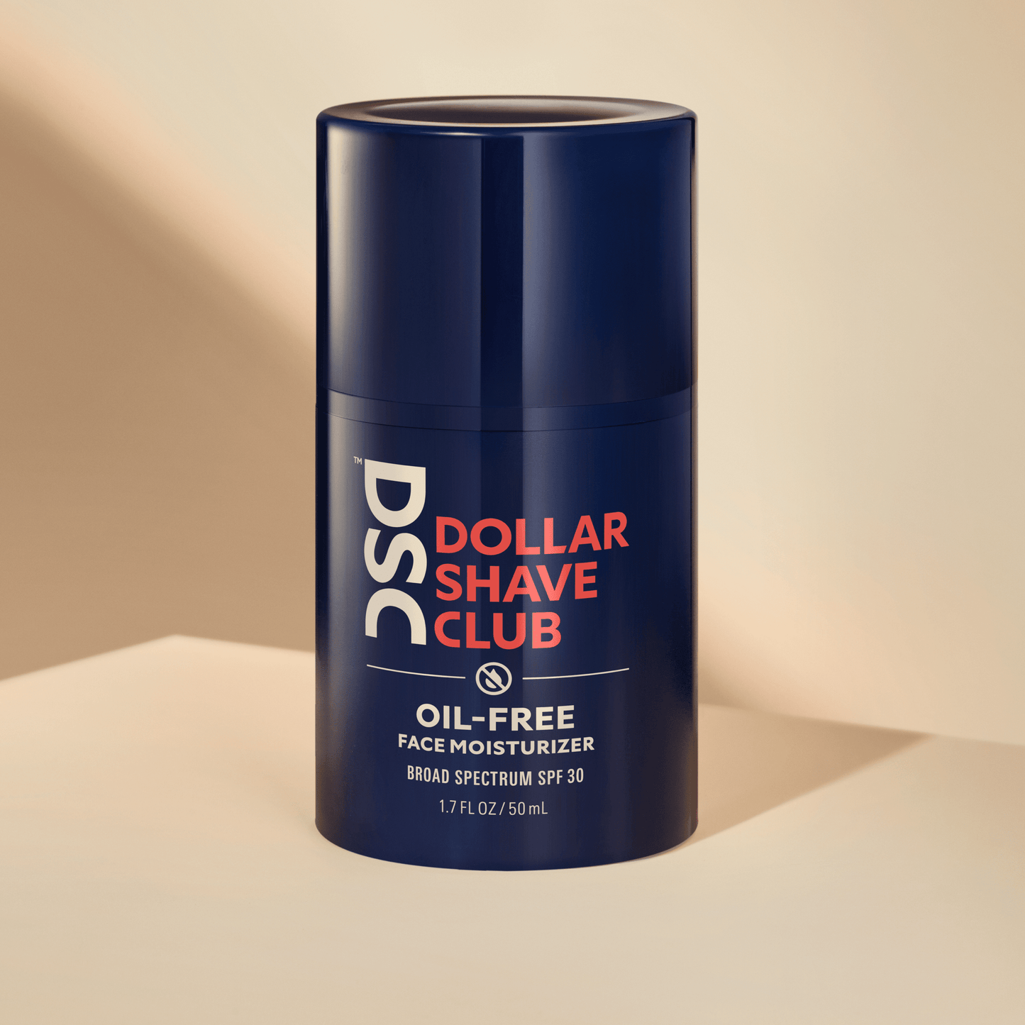 Dollar Shave Club Oil Free Face Moisturizer against tan backdrop.